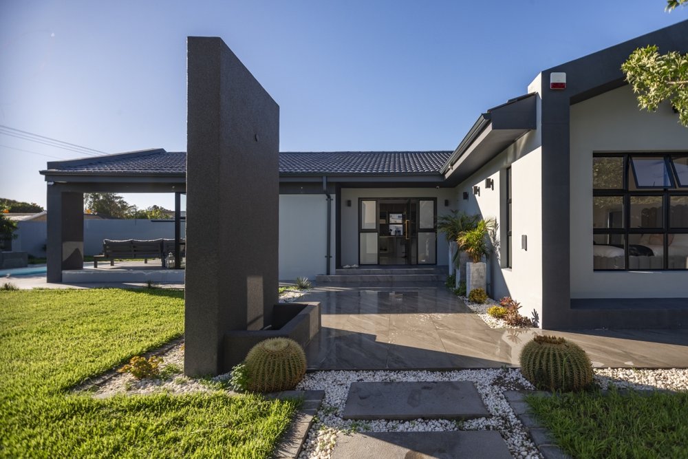Front entrance walkway with cactus planting and stone paving