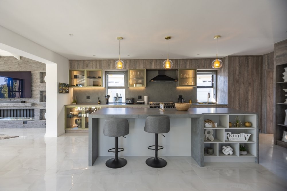 Kitchen island with bar stools and open shelving
