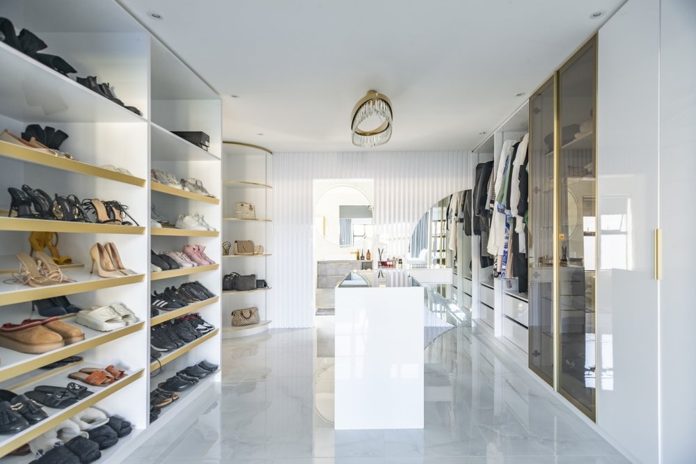 Walk-in dressing room shoe wall and handbag shelving