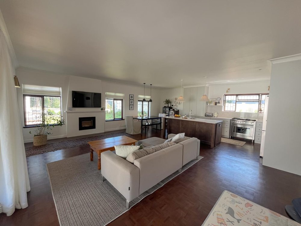 Open-plan living and kitchen area with parquet flooring
